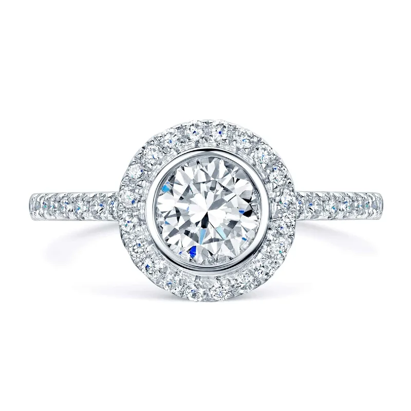 women’s platinum sapphire engagement rings-Platinum Round Brilliant Cut Diamond Ring With A Rub Over Setting And Claw Set Diamond Shoulders